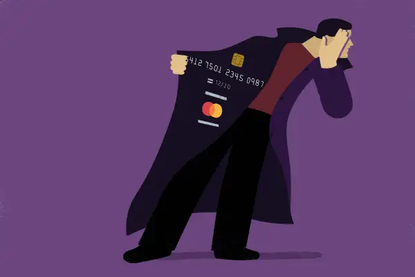 A thief is covering his face and showing the credit card number from his coat