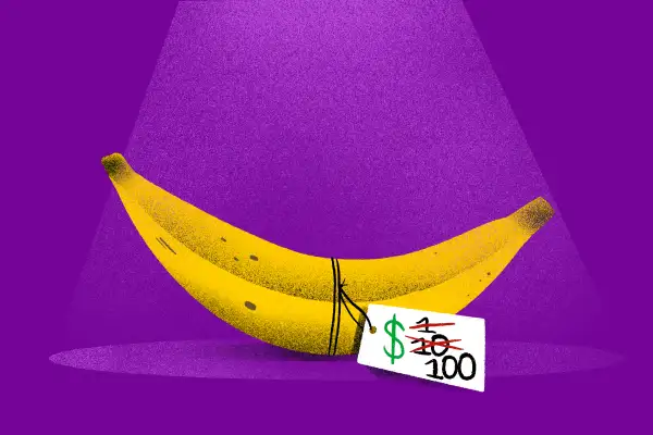 A simple banana in the spotlight with a fluctuating price tag that reads $1 then $10 then $100