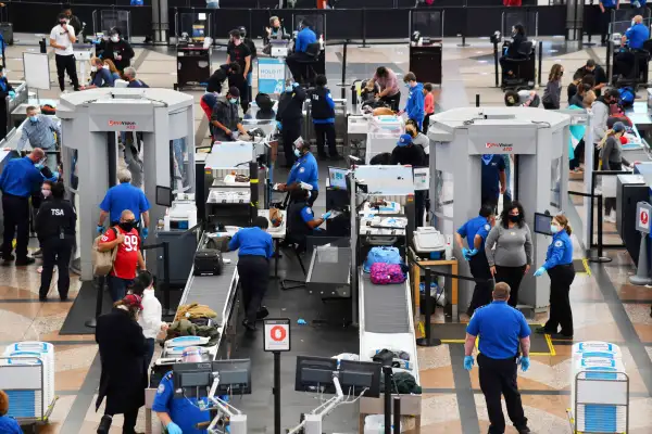 Transportation Security Administration crews are checking baggages of travelers at the security checking point at an airport