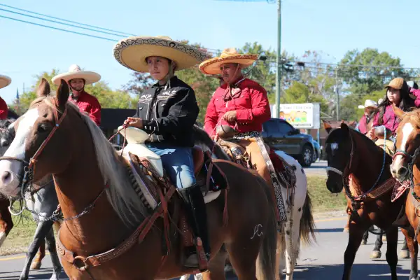 A group of people horseback ride through the streets in La Vergne Tennessee