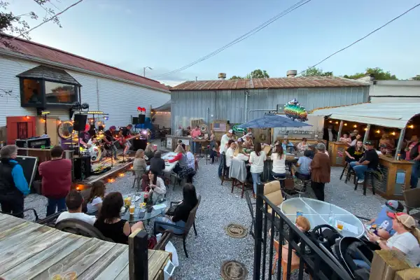 People gather to have drinks and listen to live music at the Mississippi Ale House in Olive Branch