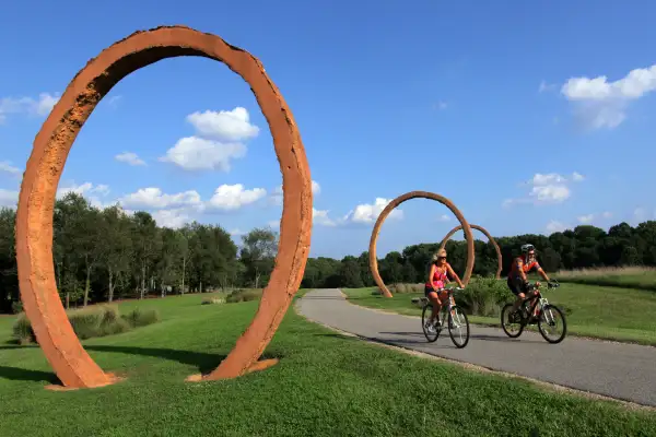 Two bikers at the Ann and Jim Goodnight Museum Park at Raleigh, North Carolina