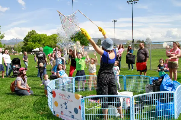 Kids play with bubbles at a local park in South Jordan Utah