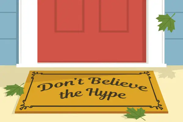 Don't Believe The Hype  writing on a doormat in front of a new house.