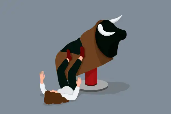 A woman is attempting to ride a mechanical bull (the market) but falling off to the ground.