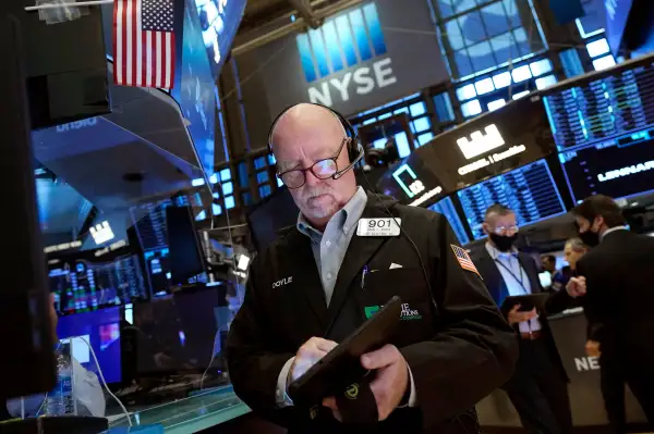 Trader John Doyle works on the floor of the New York Stock Exchange