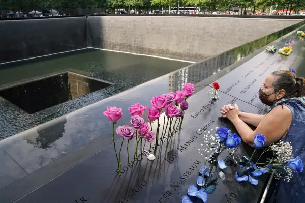 A mourner prays at the National September 11 Memorial and Museum in New York City