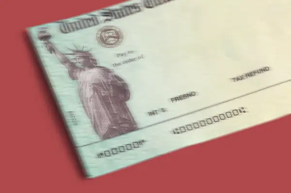 A blurry stimulus check on a red background