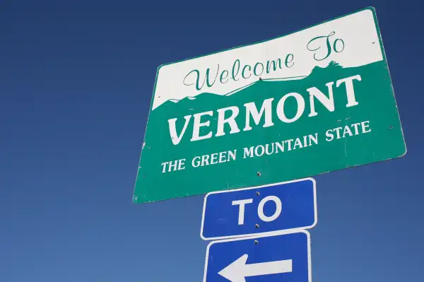 Photograph of a  Welcome To Vermont. The Green Mountain State  sign