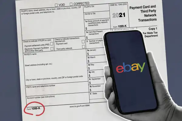 Hand Holding Phone With Ebay Logo On Screen Over A 1099K Tax Form