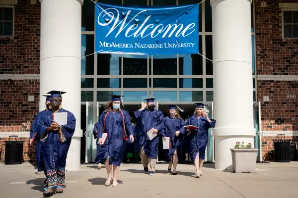 Graduates walk out of the 2021 Commencement ceremony at MidAmerica Nazarene University