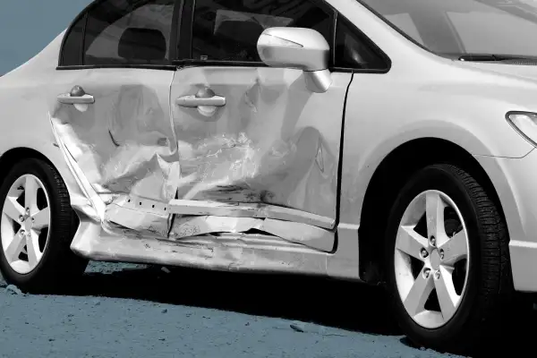 Close-up of a side impact crash on a silver car