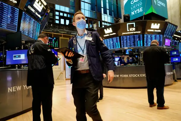 Traders work on the floor of the New York Stock Exchange