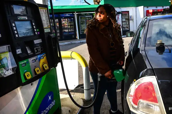 Woman Pumping Gas