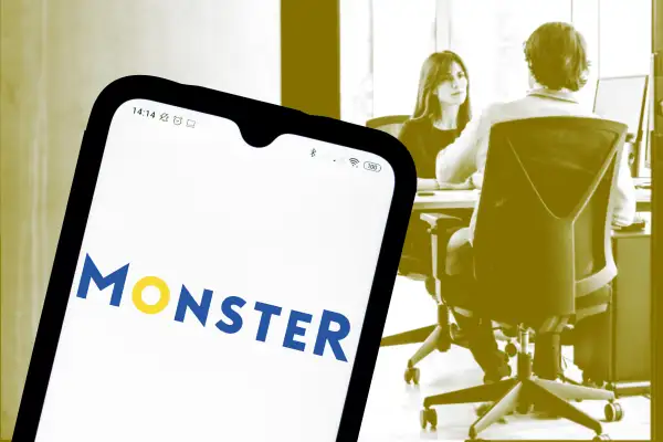Collage of a smartphone with the Monster logo with an image of a two people in an office conducting an interview in the background