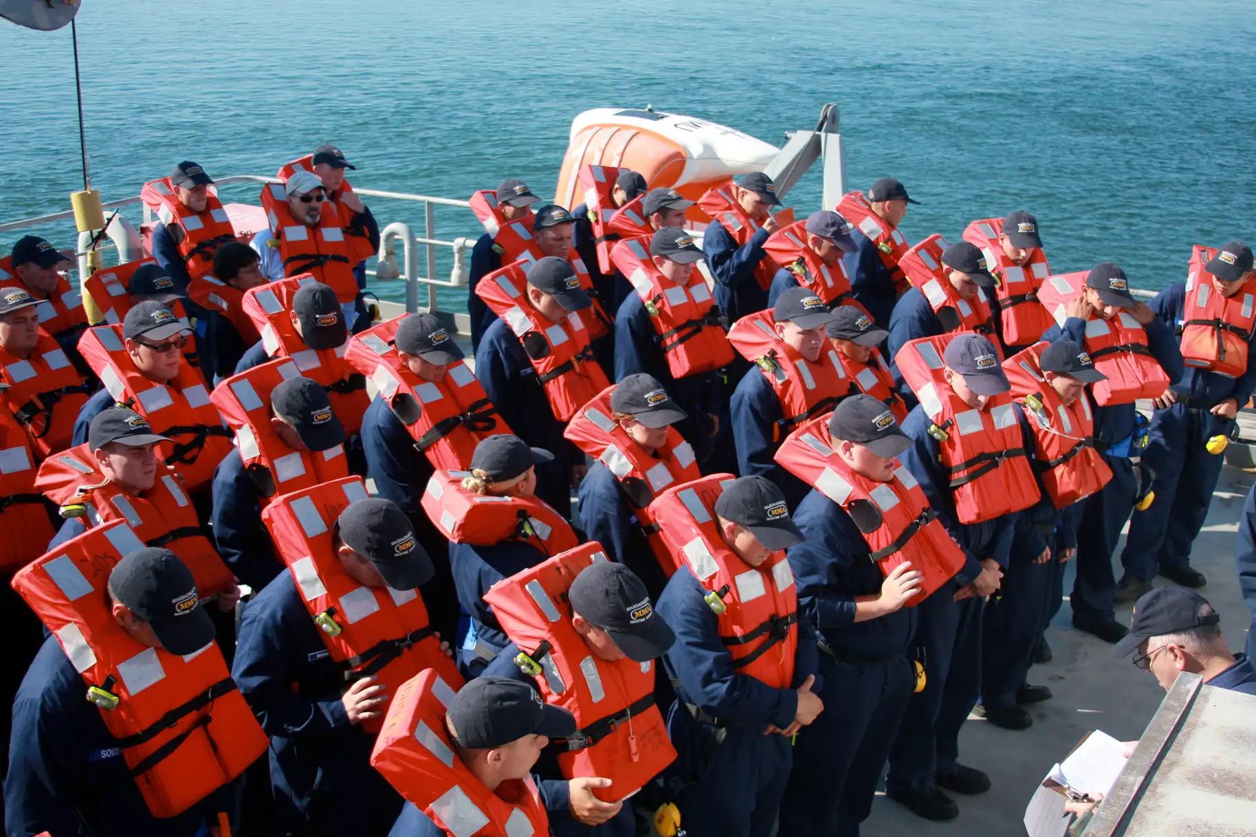 row of students of The Massachusetts Maritime Academy during a safety drill