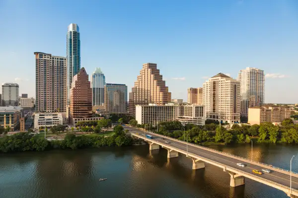 Texas skyline including Congress Avenue bridge over Ladybird Lake, Austin