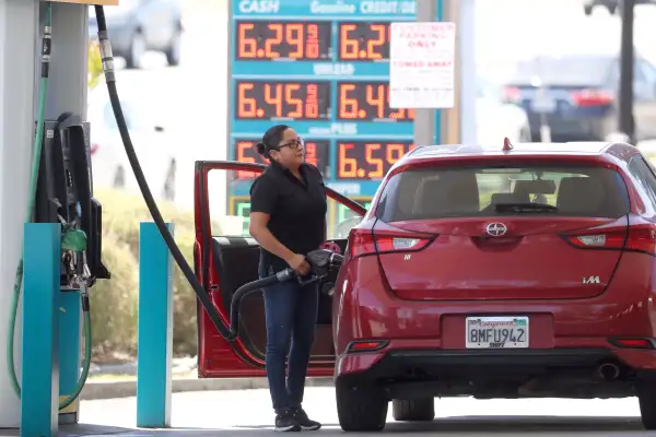 A customer pumps gas into their car at a gas station on May 18, 2022 in Petaluma, California