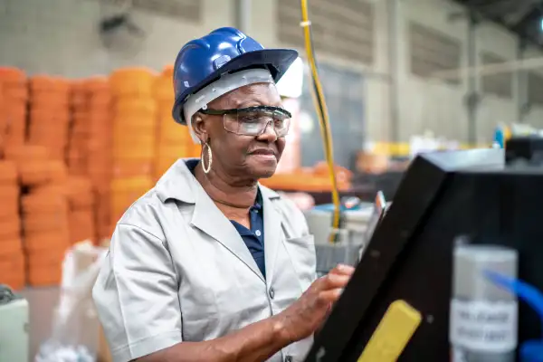 Senior woman working in a factory
