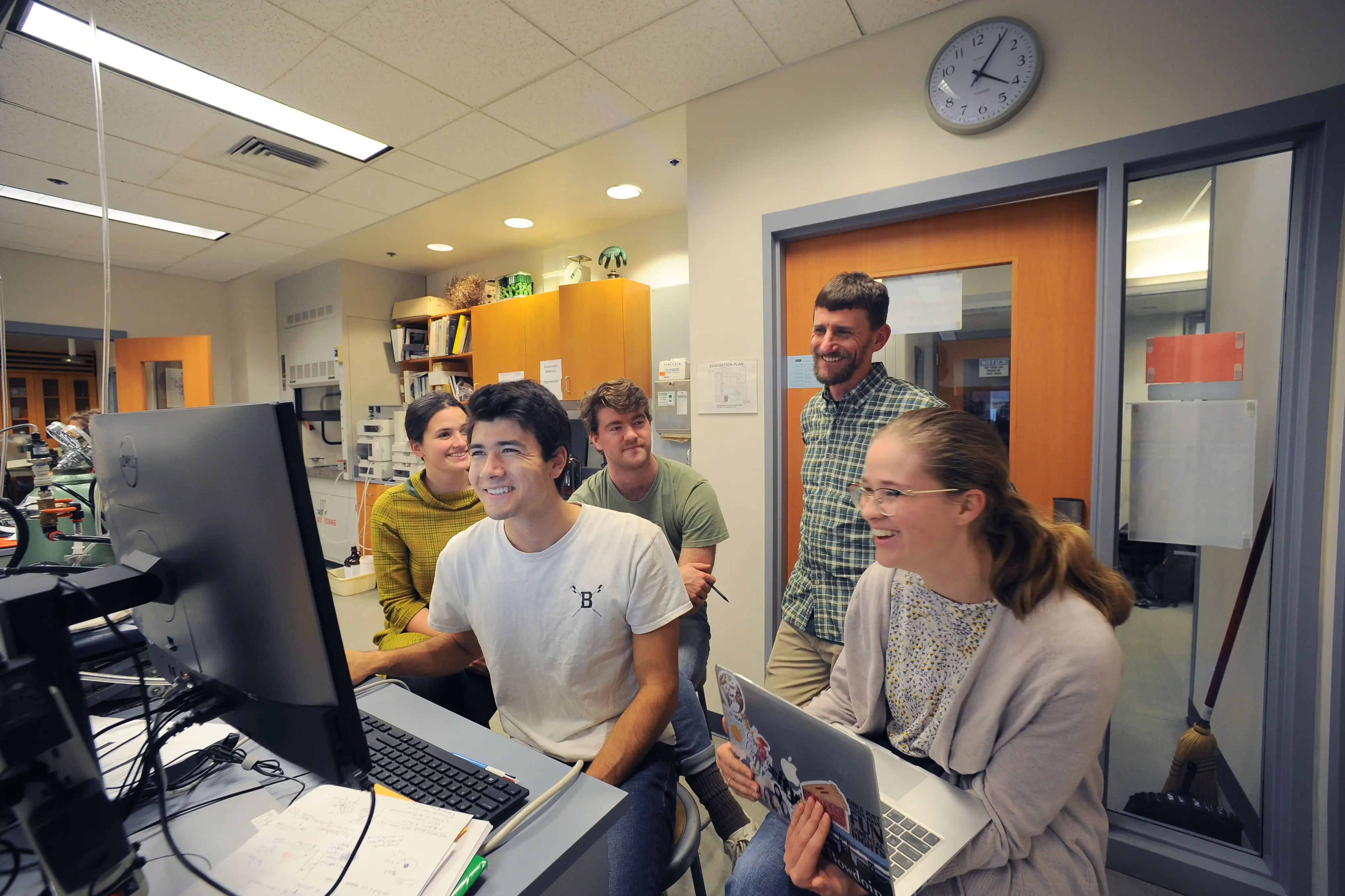 Students working on their laptops in a classroom at Bowdoin College