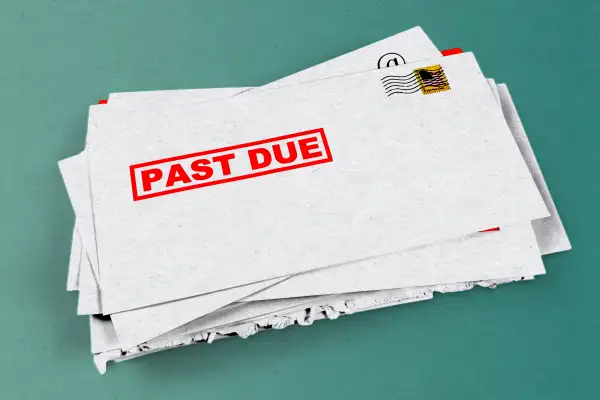 Illustration of various debt collector letters that are past due