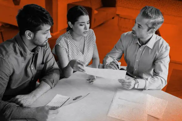 People inspecting their home mortgage papers