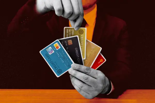 Photo collage of a man with many credit cards in his hand as if they were playing cards