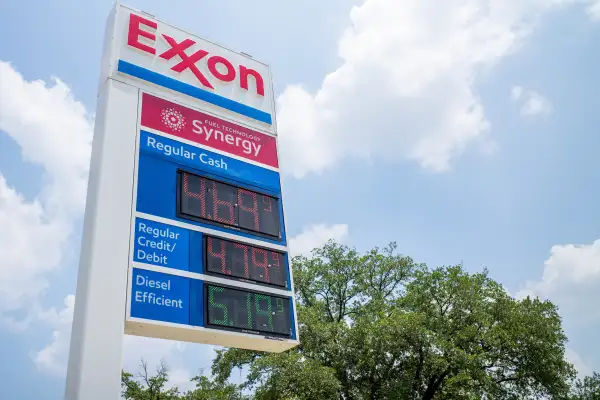 Gas prices are displayed on a gas station board