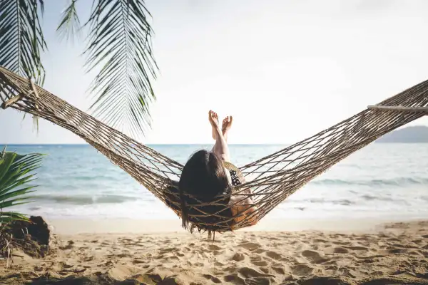 Woman On Hammock On Beach