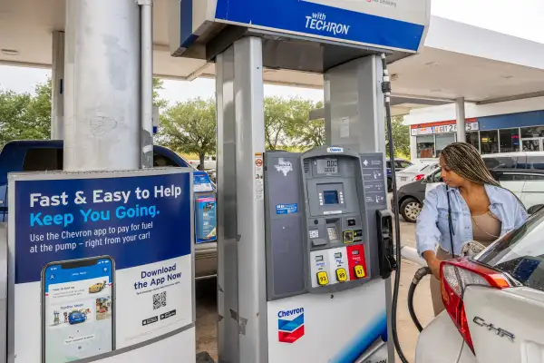 Customer prepares to pump gas at a Chevron gas station