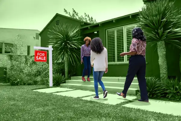 Photo of people about to inspect a property for sale