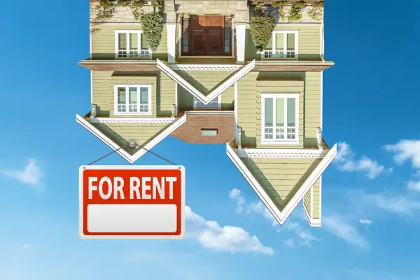 Photo Collage of an upside down house in the sky with a rent sign