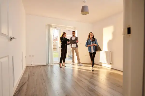 A couple at a open house with real-estate agent