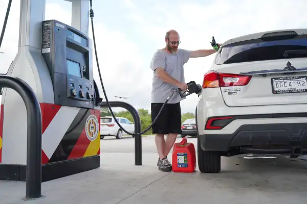 Man refueling the gas tank of his car