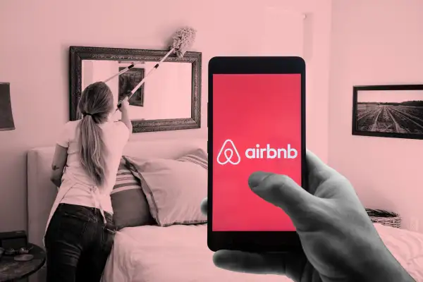 Photo collage of a hand holding a smartphone with the Airbnb app and a woman cleaning a house in the background