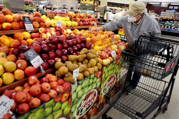 Man shopping for fruit at a supermarket