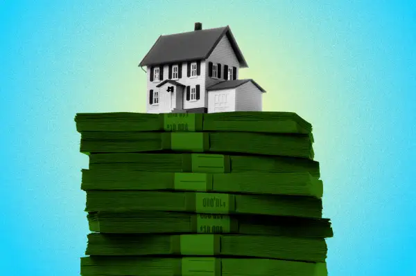 Photo Illustration of a toy house on top of stack of dollar bills