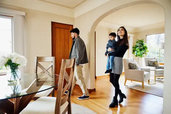 Family looking at a house for sale during an open house