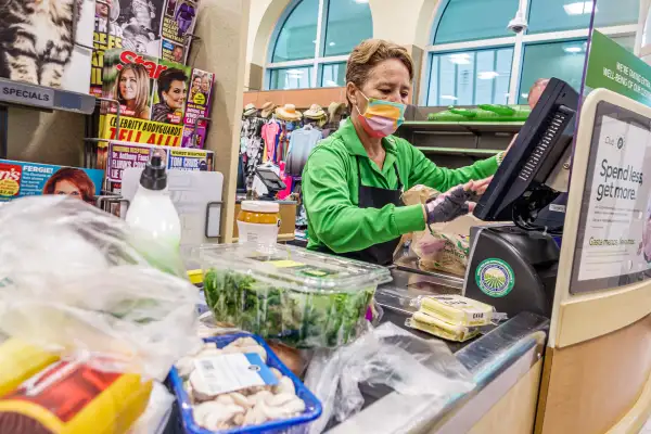 Woman cashier at a supermarket store
