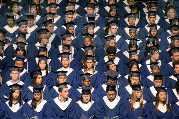 Graduating class in caps and gowns at commencement