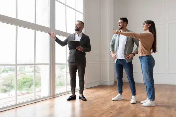 Couple inspects a new house with a realtor