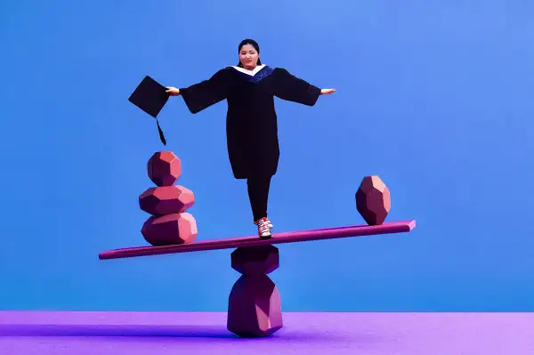 Photo collage of a graduate student standing in the middle of a slightly unbalanced seesaw with rocks on either side