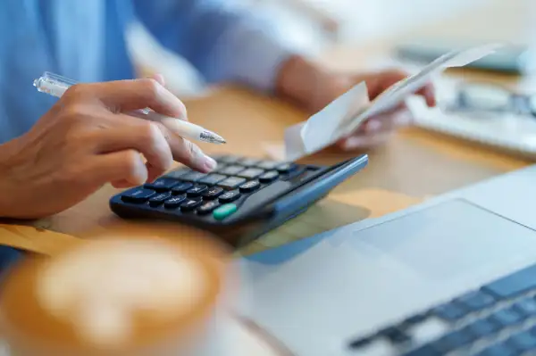 Close-up of a person using the calculator