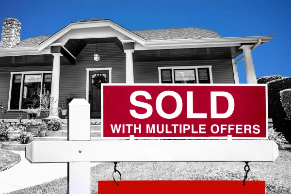 Photo Collage of a house with a  Sold With Multiple Offers  sign