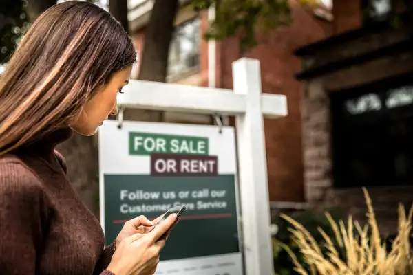 woman looking at house for sale