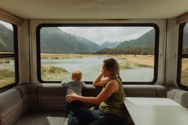 Mother and baby relaxing in motorhome, Queenstown, Canterbury, New Zealand