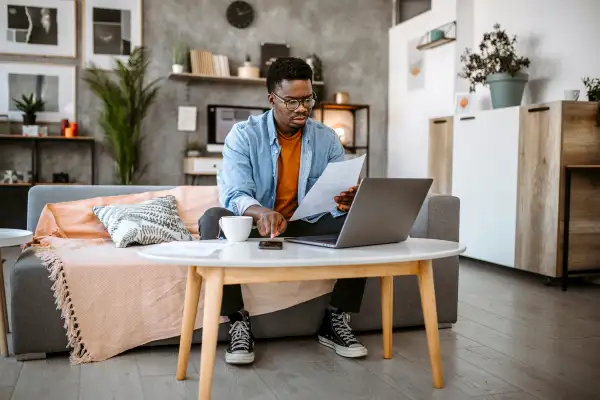 Man checking home financial reports