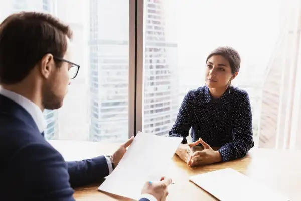 Young male hr manager communicating with Indian job seeker.