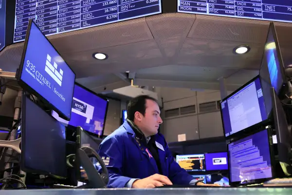 Trader works on the floor of the New York Stock Exchange