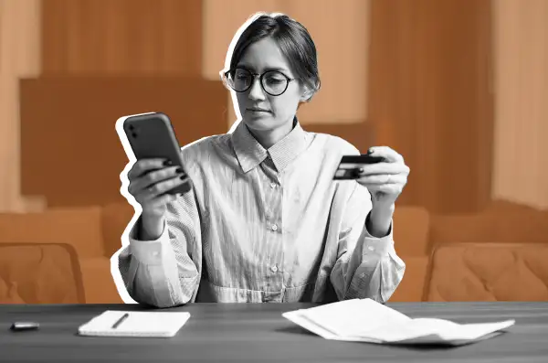 Young woman holding credit card